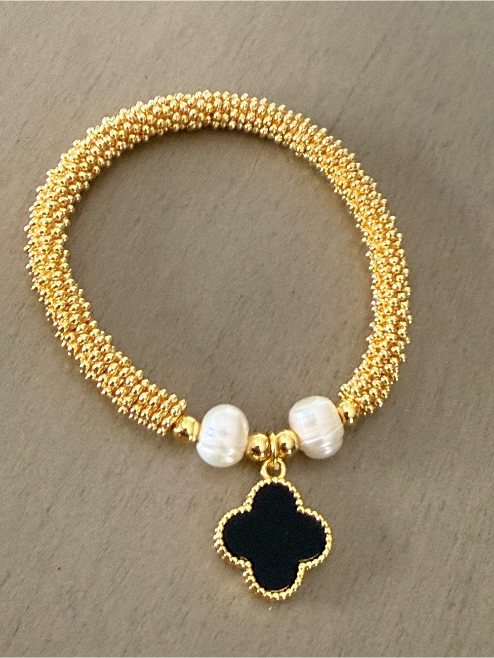 Gold Beaded Bracelet with Black Clover Charm and Pearl Accents